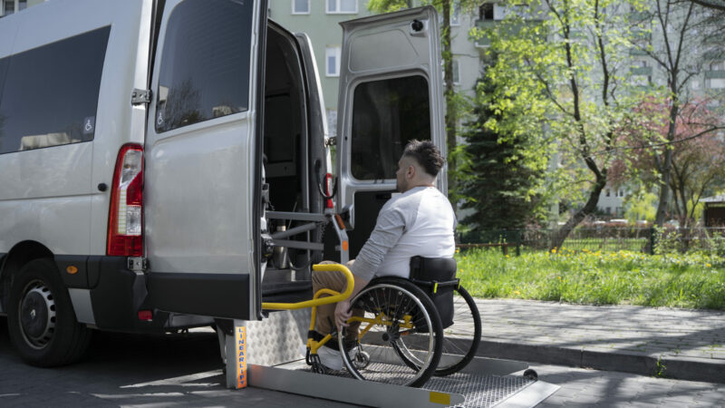 full-shot-disabled-man-getting-car